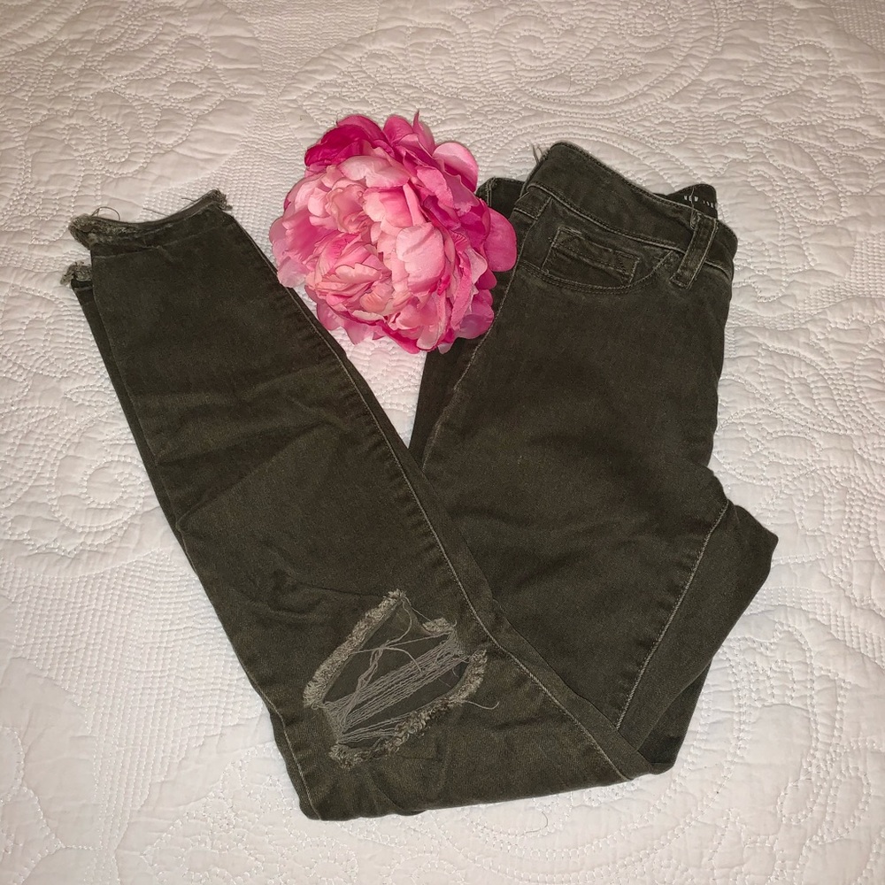 Olive distressed skinny jeans